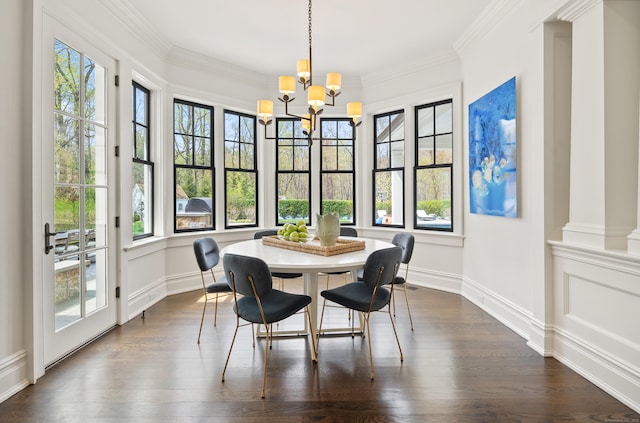 29 Sturges Commons, Westport, CT 06880 - dining area featuring ornamental molding, an inviting chandelier, dark wood-style flooring, and plenty of natural light