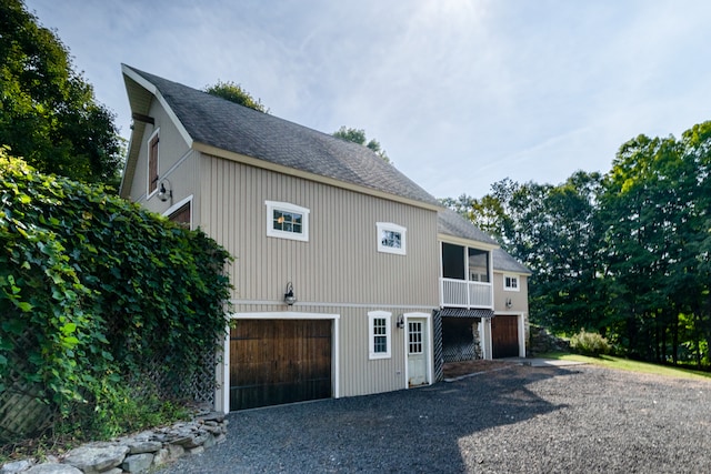 view of side of property featuring a garage