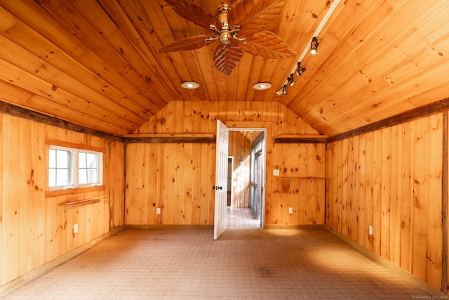 bonus room featuring wood walls, ceiling fan, wooden ceiling, and vaulted ceiling