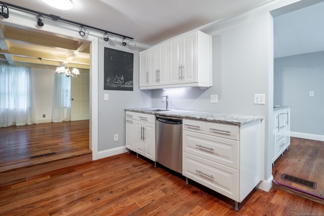 kitchen with white cabinetry, a chandelier, stainless steel dishwasher, dark hardwood / wood-style floors, and beamed ceiling