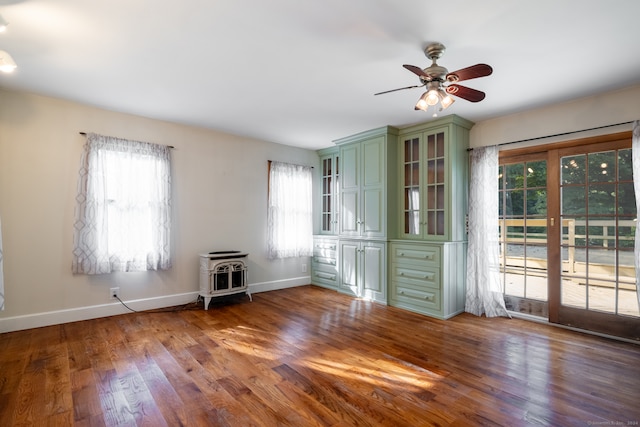 interior space featuring hardwood / wood-style floors, a healthy amount of sunlight, and ceiling fan