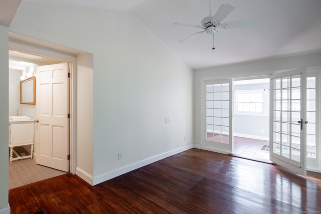 spare room featuring lofted ceiling, french doors, hardwood / wood-style flooring, and ceiling fan