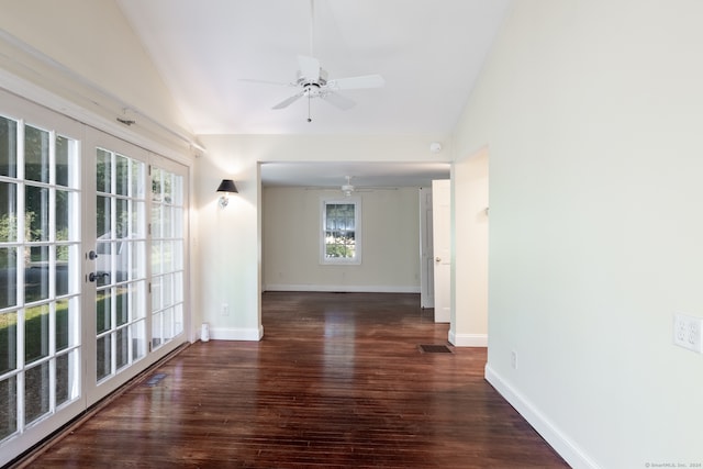 interior space with ceiling fan, dark wood-type flooring, and vaulted ceiling