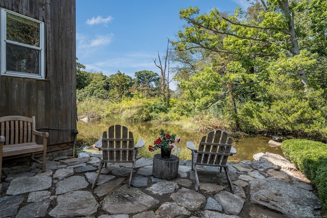 view of patio / terrace featuring a water view