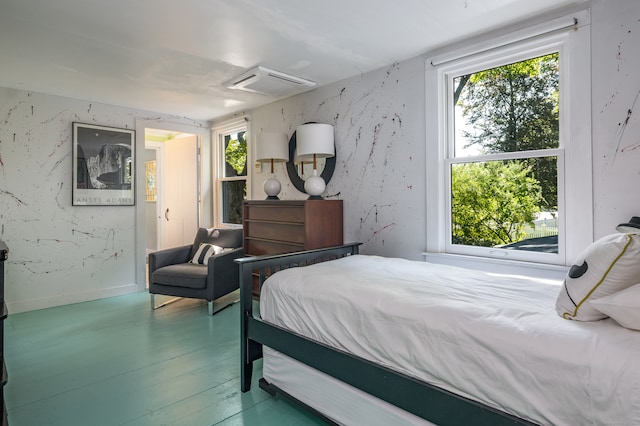 bedroom with hardwood / wood-style floors