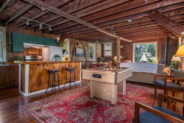 interior space with wood walls and dark hardwood / wood-style floors