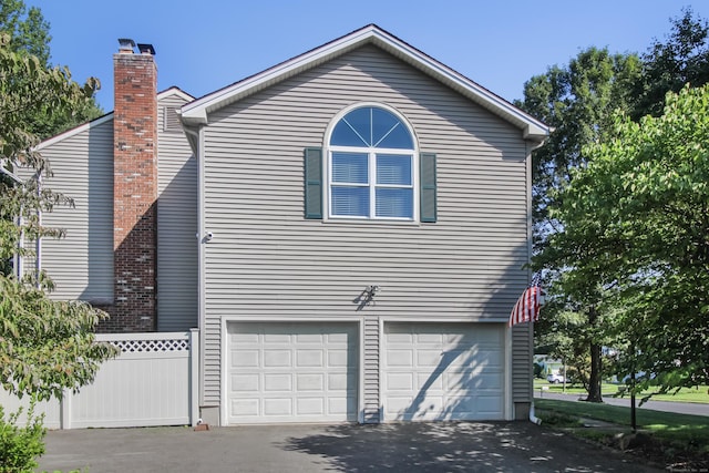 view of side of property with a garage