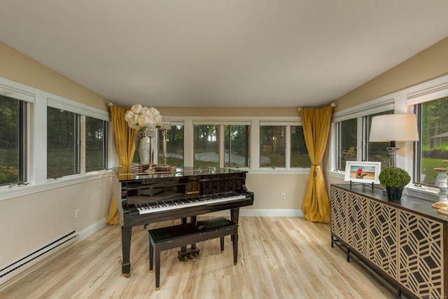 misc room featuring a baseboard radiator and light hardwood / wood-style floors