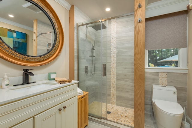 bathroom featuring tile walls, ornamental molding, toilet, walk in shower, and vanity