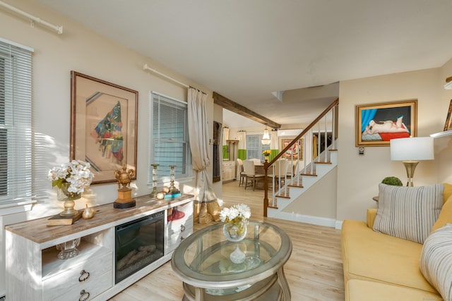 living room featuring light hardwood / wood-style floors and plenty of natural light