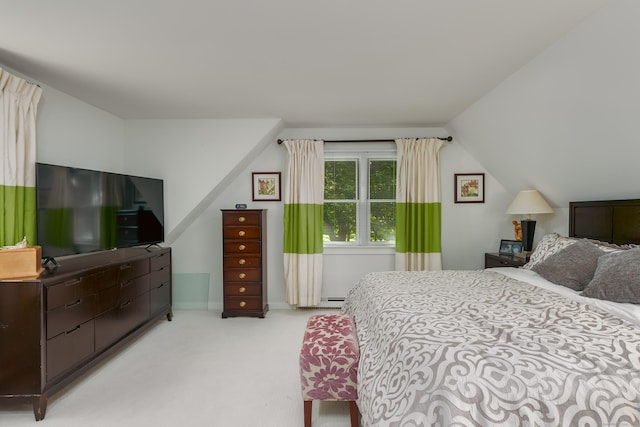 carpeted bedroom with lofted ceiling