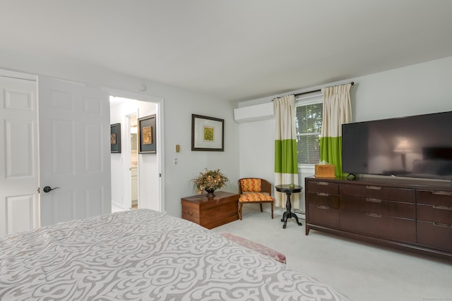 bedroom with light carpet and a wall mounted air conditioner