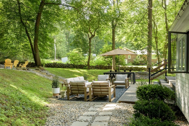 view of yard with an outdoor living space and a deck