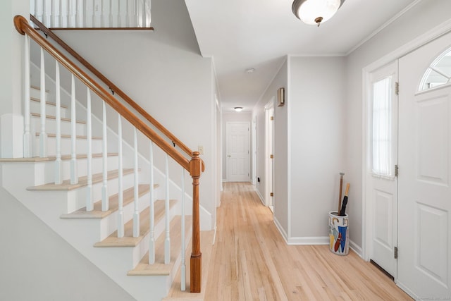14 Stilson Ln, New Milford, CT 06776 - foyer entrance featuring light wood-style flooring, crown molding, baseboards, and stairway