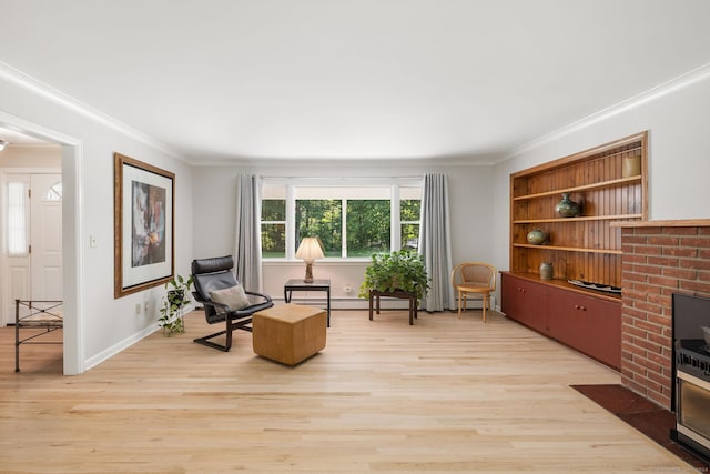 14 Stilson Ln, New Milford, CT 06776 - sitting room with light wood-style flooring, crown molding, a baseboard heating unit, and baseboards