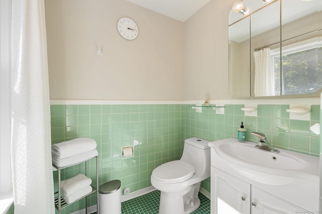 14 Stilson Ln, New Milford, CT 06776 - full bath with vanity, tile patterned flooring, a wainscoted wall, toilet, and tile walls