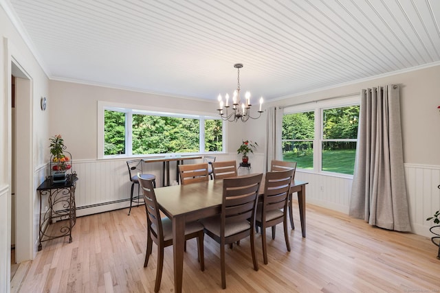 14 Stilson Ln, New Milford, CT 06776 - dining room featuring a baseboard radiator, a healthy amount of sunlight, a notable chandelier, and wainscoting