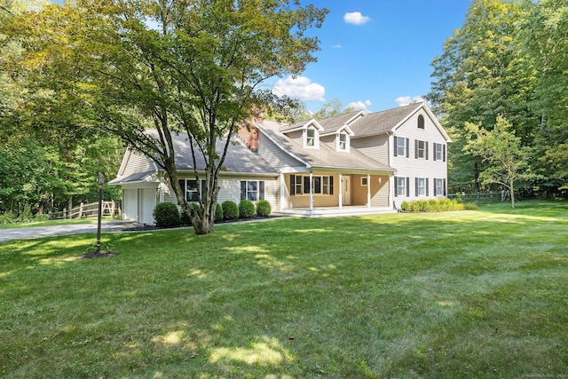 14 Stilson Ln, New Milford, CT 06776 - view of front facade featuring aphalt driveway, a front yard, fence, and an attached garage