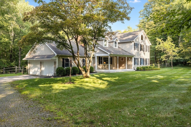 14 Stilson Ln, New Milford, CT 06776 - view of front facade featuring a front lawn, fence, an attached garage, and driveway