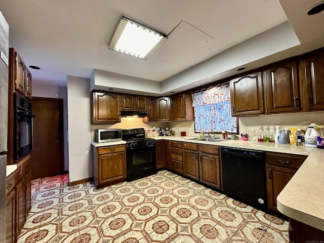 68 Todd St, Hamden, CT 06518 - kitchen featuring a sink, dark brown cabinetry, light countertops, under cabinet range hood, and black appliances