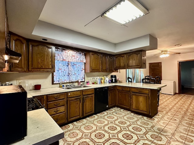 68 Todd St, Hamden, CT 06518 - kitchen with under cabinet range hood, light countertops, dishwasher, a sink, and a peninsula
