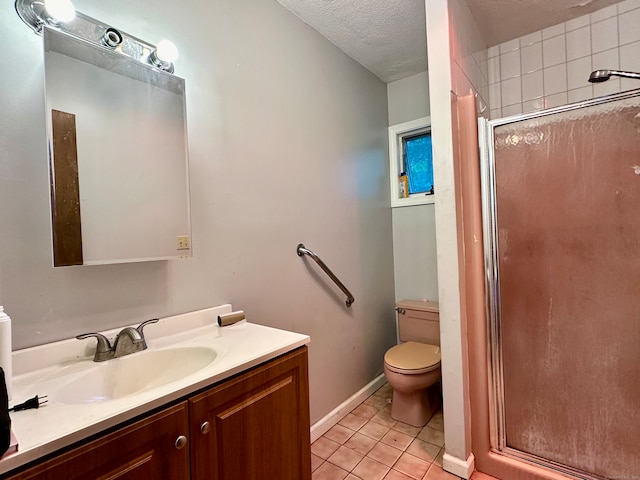 bathroom with a textured ceiling, a shower with shower door, vanity, tile patterned flooring, and toilet