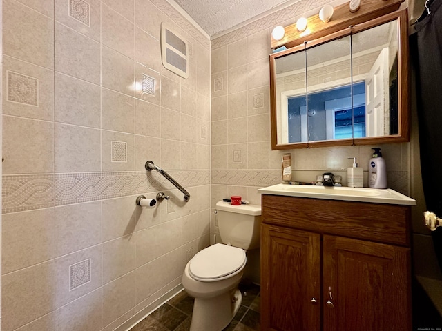 68 Todd St, Hamden, CT 06518 - bathroom with tile walls, a textured ceiling, toilet, and vanity