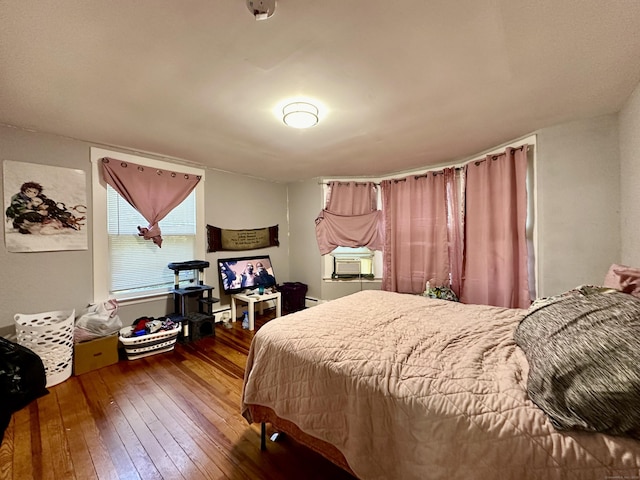 68 Todd St, Hamden, CT 06518 - bedroom featuring a baseboard radiator, hardwood / wood-style floors, and cooling unit