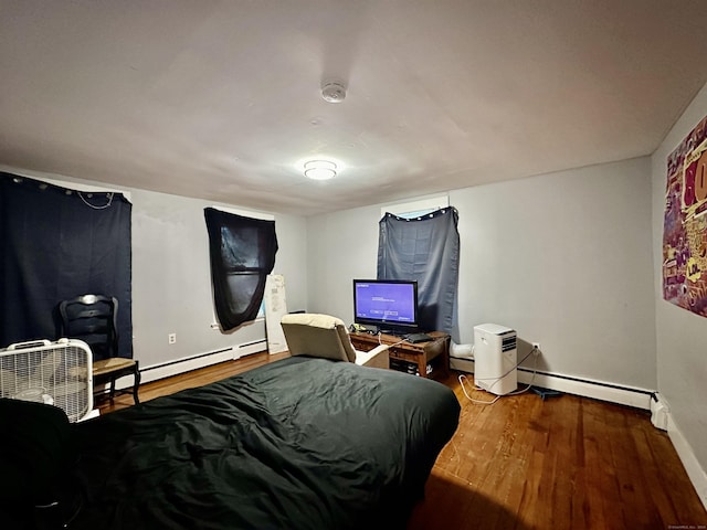 68 Todd St, Hamden, CT 06518 - bedroom with baseboards, baseboard heating, and wood finished floors