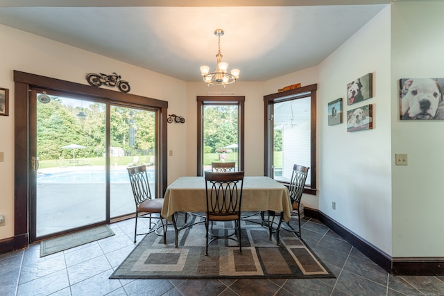 dining space featuring a chandelier