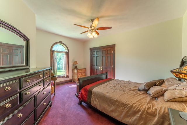 bedroom with a closet, ceiling fan, and carpet floors