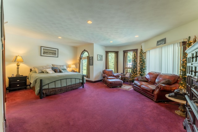 carpeted bedroom featuring a textured ceiling