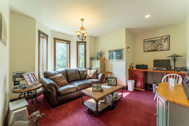 carpeted living room with a chandelier