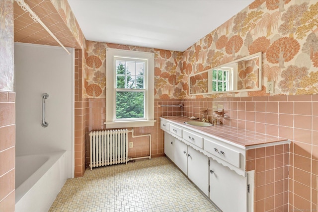 175 Sugar St, Newtown, CT 06470 - bathroom featuring shower / bathing tub combination, vanity, tile walls, tile patterned floors, and radiator heating unit