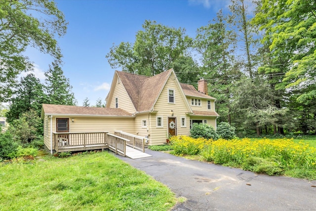 175 Sugar St, Newtown, CT 06470 - rustic home with a chimney, a shingled roof, a wooden deck, and a front yard