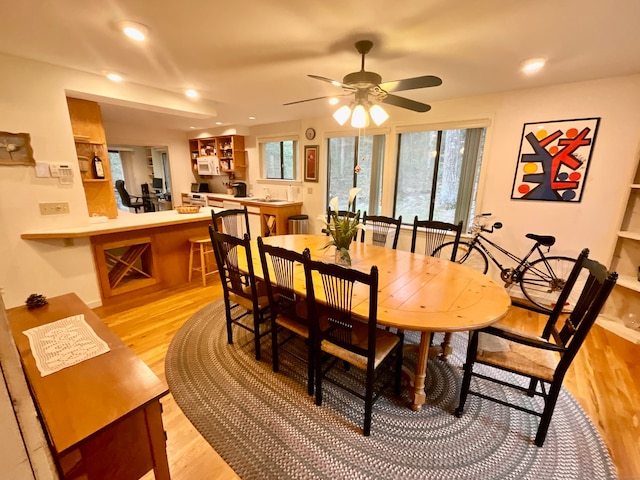 dining room featuring ceiling fan and light hardwood / wood-style flooring