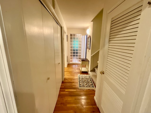 hall with hardwood / wood-style flooring