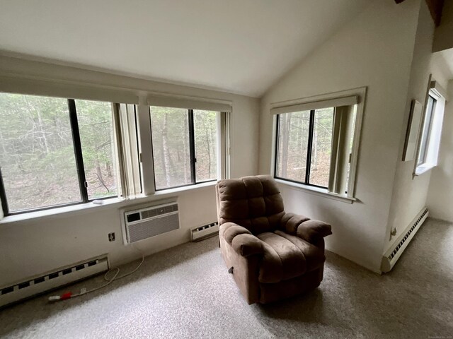 living area with a wall mounted air conditioner, a baseboard heating unit, lofted ceiling, and carpet