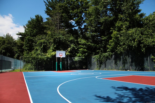view of basketball court with fence and community basketball court