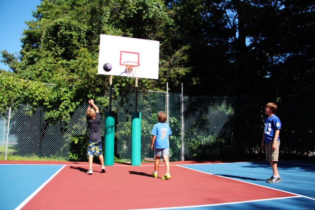 view of sport court with community basketball court and fence