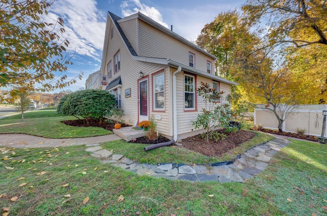 view of home's exterior with a yard