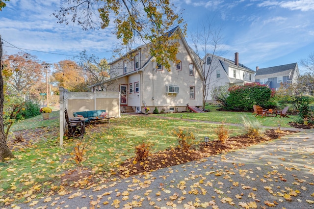 view of side of property featuring a yard