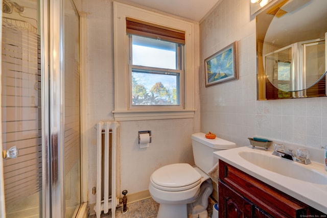 bathroom featuring a shower stall, radiator, tile walls, and toilet