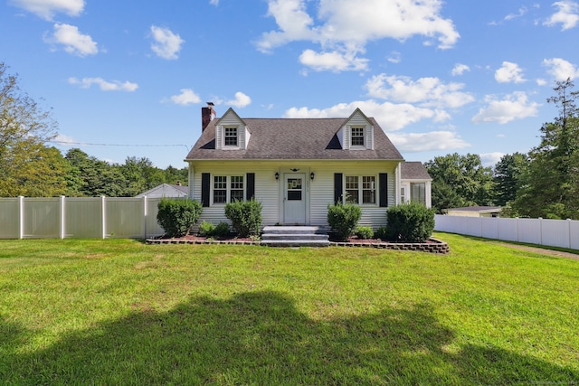 cape cod house with a front yard