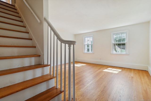 stairway featuring hardwood / wood-style flooring