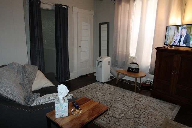 living room with dark wood-type flooring