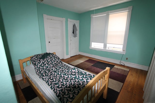 bedroom featuring wood-type flooring