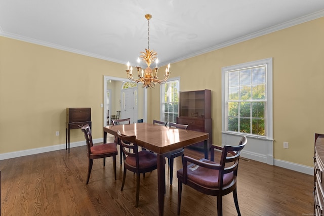 dining room with a chandelier, dark hardwood / wood-style flooring, and crown molding