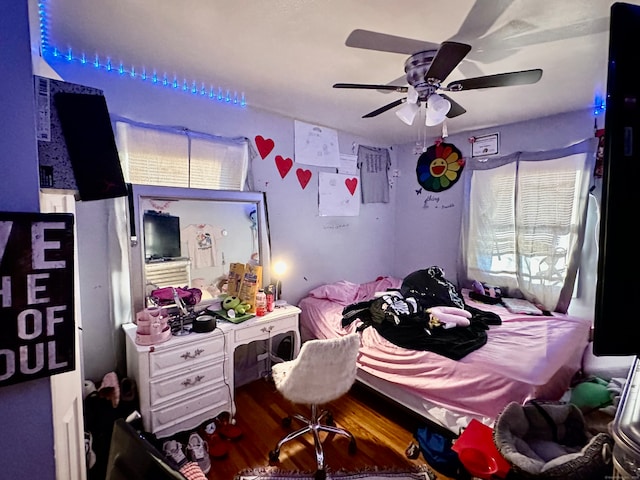 bedroom featuring ceiling fan and dark hardwood / wood-style flooring