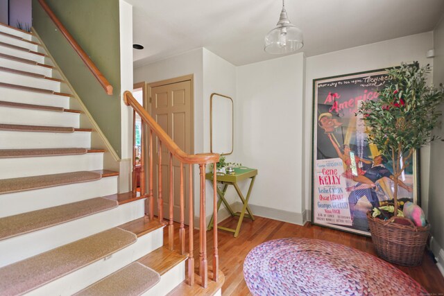 stairs with wood-type flooring